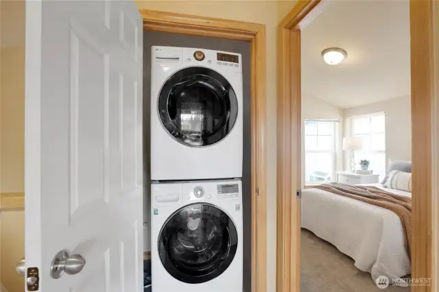 The stackable washer and dryer are conveniently located upstairs and are included in the sale.