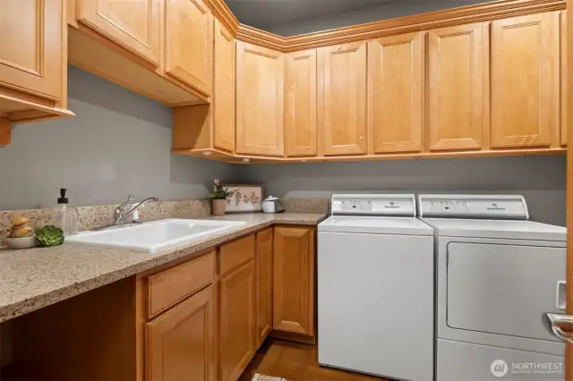 Nicely sized laundry room with tons of storage. Leads to three car garage.
