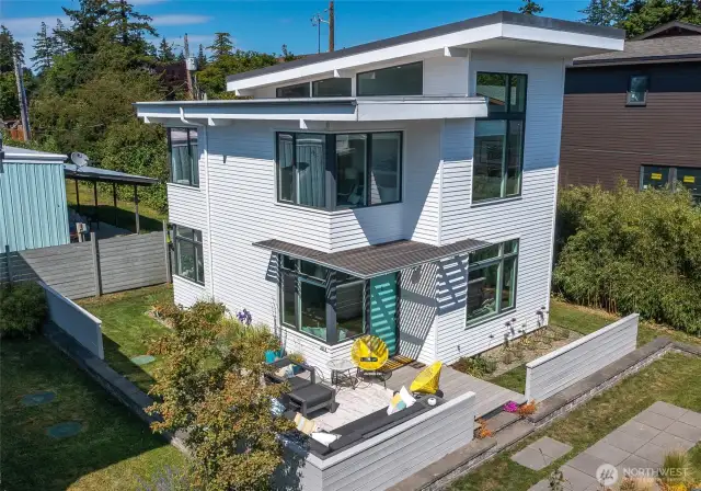 This clean, contemporary home in the middle of downtown Eastsound is being sold with an active vacation rental permit. It is an excellent investment property or simply convenient village living.