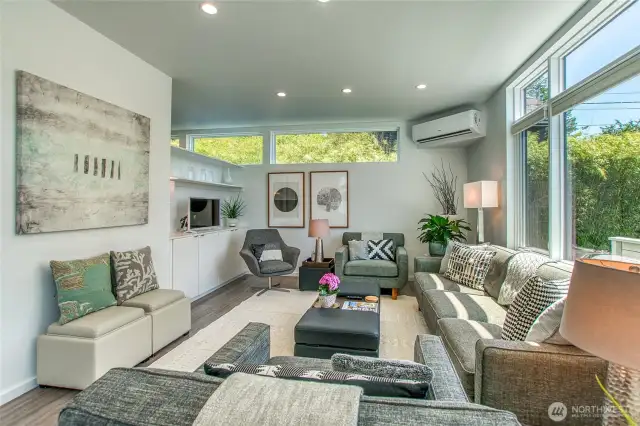 Large windows and vaulted ceilings provide for a naturally bright home all year.