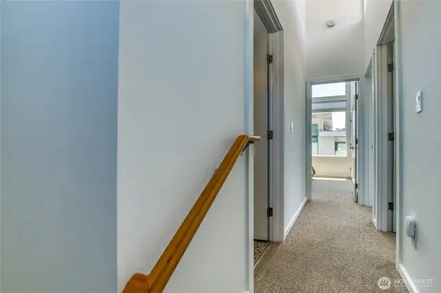 Steps leading up to the second level where the three bedrooms are located.