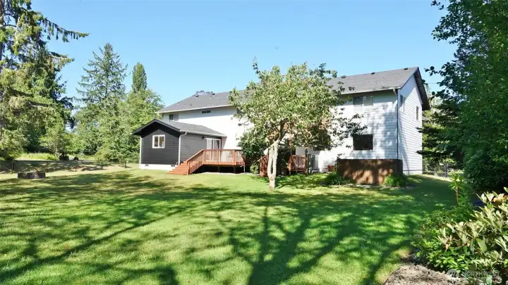 Rear of the home and huge backyard.