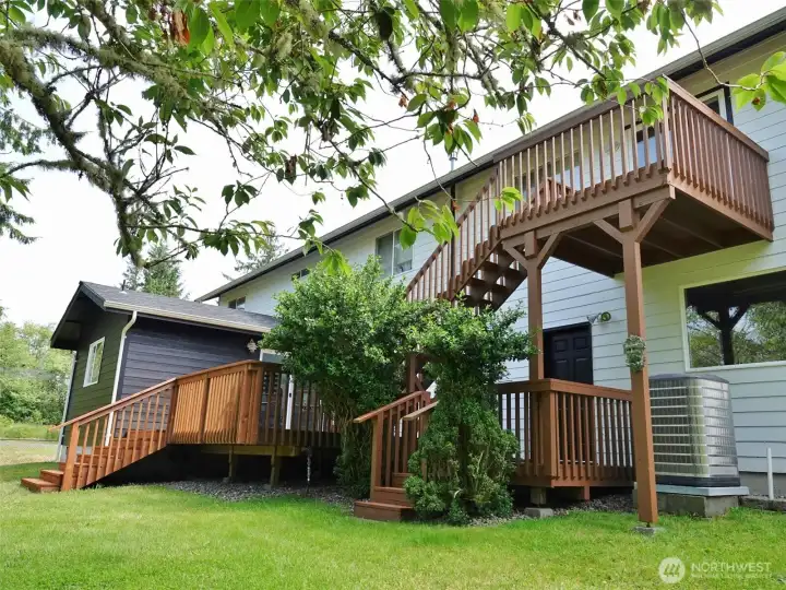 Rear of the home w/ 2 connected decks.