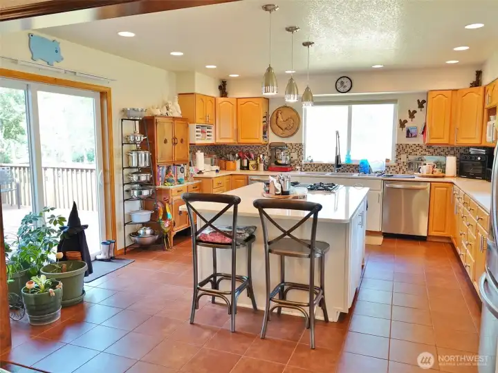 Spacious Kitchen w/ a slider to the Rear Deck and Backyard.