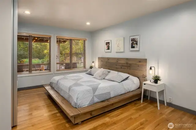 Primary Suite overlooking covered porch and yard