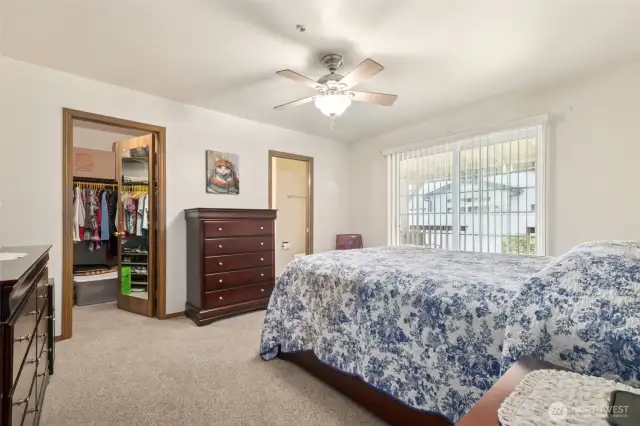 Primary bedroom with walk in closet and private 3/4 bath