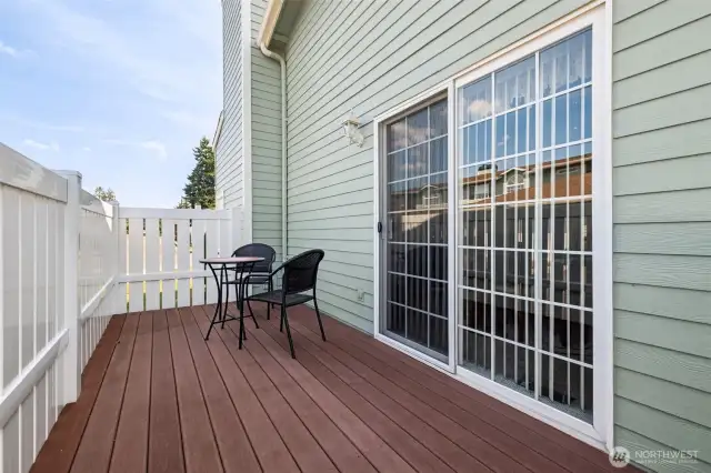 Side patio/deck accessed from dining area