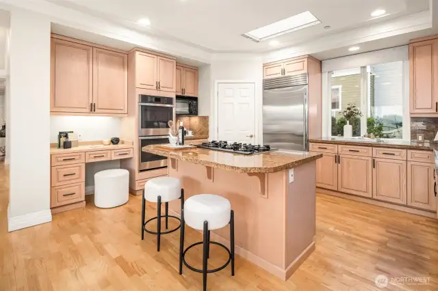 Beautifully appointed chef's kitchen features newer stainless appliances
