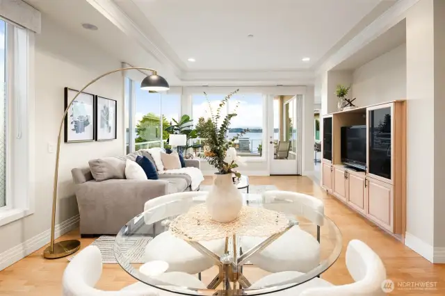 The breakfast nook and family room overlook the outdoor patio and offer lovely lake and mountain views