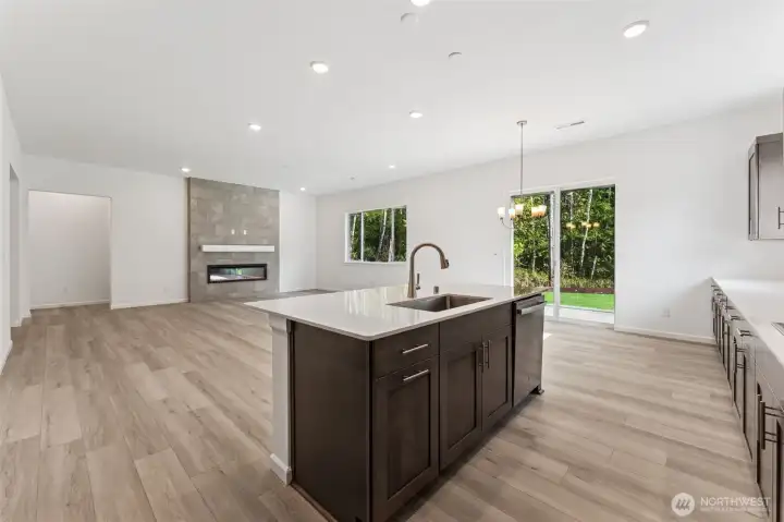 ***Actual Home*** Kitchen island looking into the Greatroom