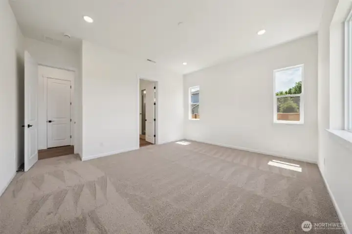 This home has a different color cabinet that is called Artic Grey stain - with a color palate of light grey flooring a grey tile. NOT ACTUAL HOME but represents the layout.