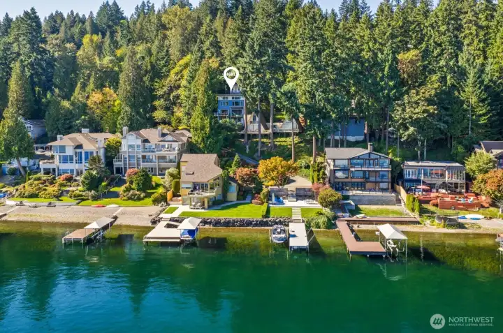 Where lake meets luxury! Perfectly nestled among evergreens, this architectural gem captures sweeping views of Lake Sammamish from every level