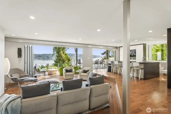 Great room designed for effortless entertaining and everyday luxury. Floor to ceiling Nana doors open completely to the covered deck, blending indoor comfort with the beauty of Lake Sammamish.