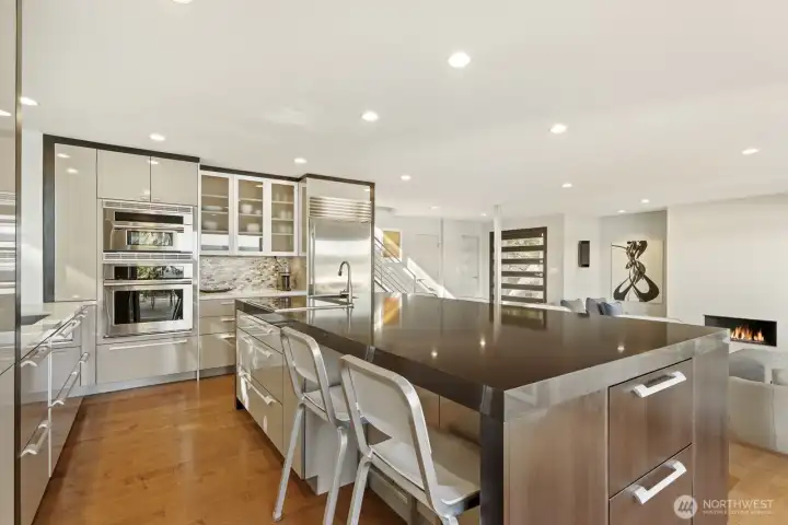 Sleek finishes, warm Maple hardwood floors and open concept kitchen. All stainless steel appliances including Island cooktop.