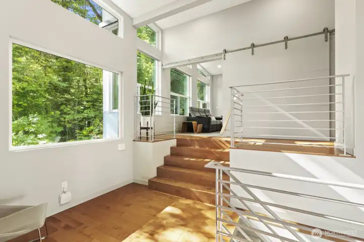 Upper landing with window walls.