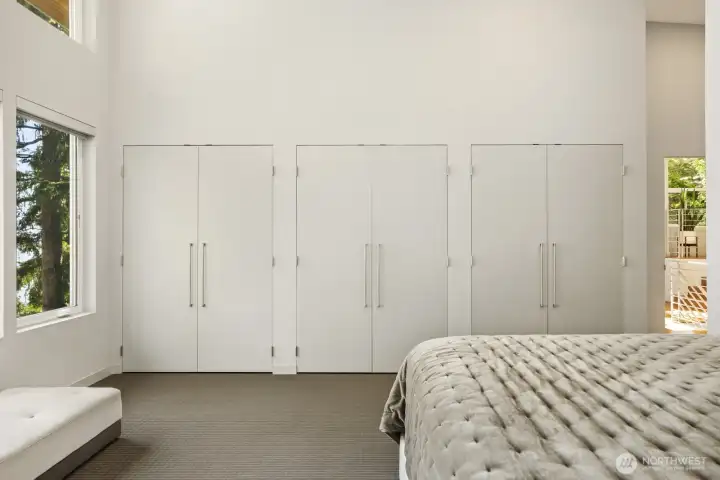 Primary with full wall of closets + walk in closet