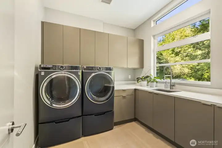 Spacious laundry room with ample stoarge