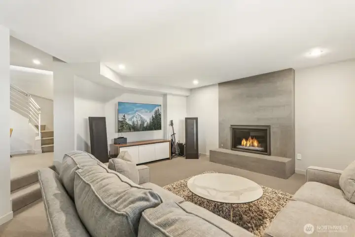 Lower level rec room with gas fireplace
