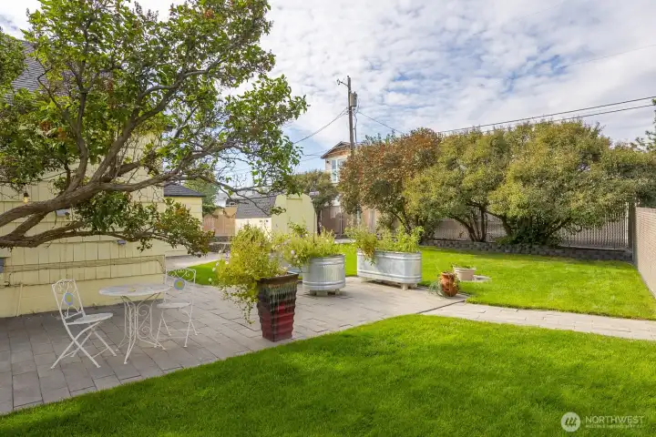 More lilac trees across the back yard ensure privacy.