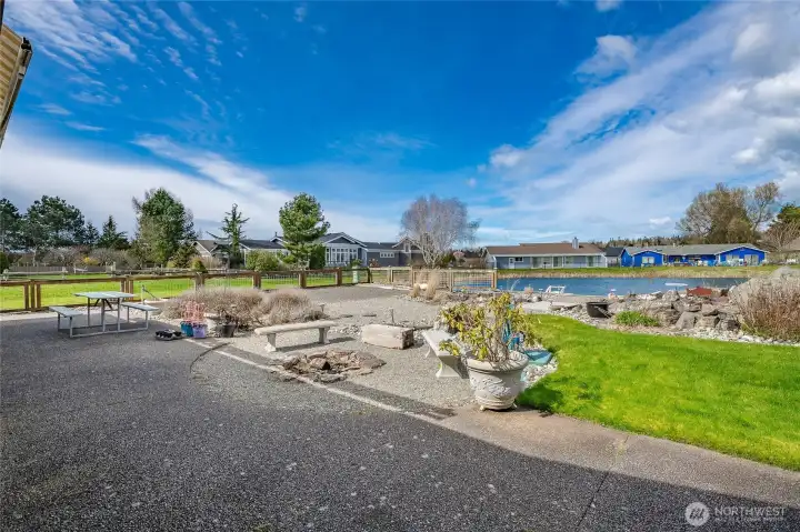 The lake front west facing yard is spacious and includes a dock & brick patio both of which could never be repeated today.
