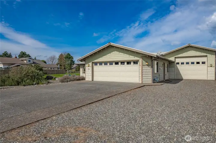 Large attached Double Garage & adjoining RV style tall RV style garage or bonus living space which is currently utilized for media and Rec room etc.