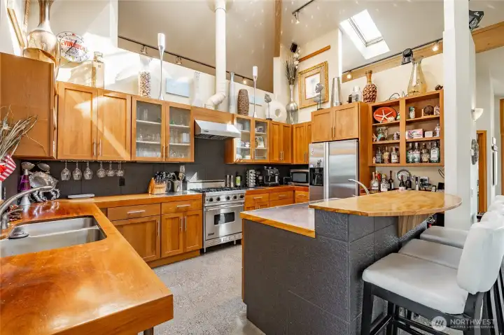 Dramatic Vaulted ceilings with soaring glue lam beams. The counters are "Superyacht" quality hardwoods and intended to provide a Nautical vibe.