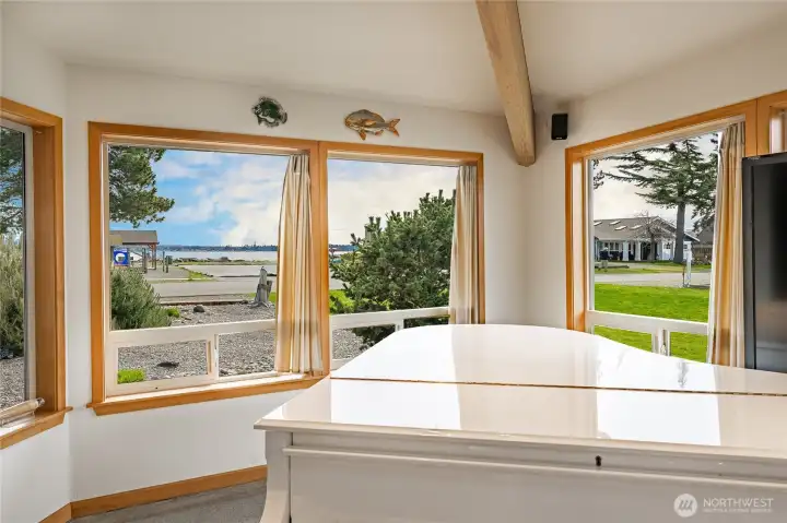 Solid wood-wrapped oversize custom windows frame the beautiful Vistas towards the Bay.