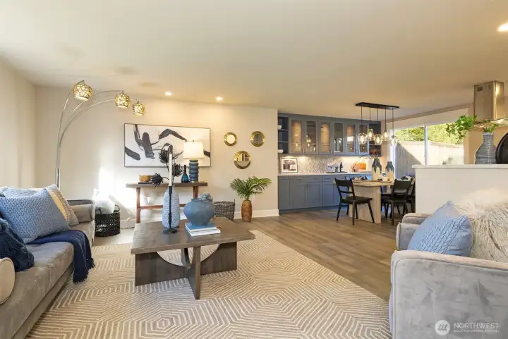 Living room opens to the dining room and views out to front and back yards