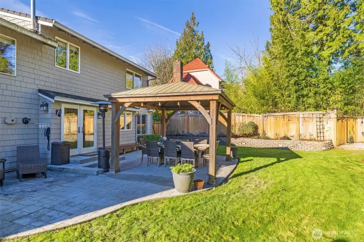 Large back yard with patio and yard space.