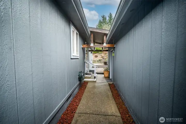covered walkway to spacious garage