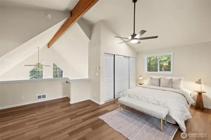Vaulted ceiling with wood beam adds character & charm.