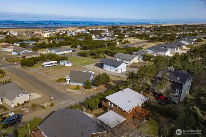 This aerial view highlights the home’s fantastic coastal location, surrounded by a peaceful neighborhood and just moments from the ocean.