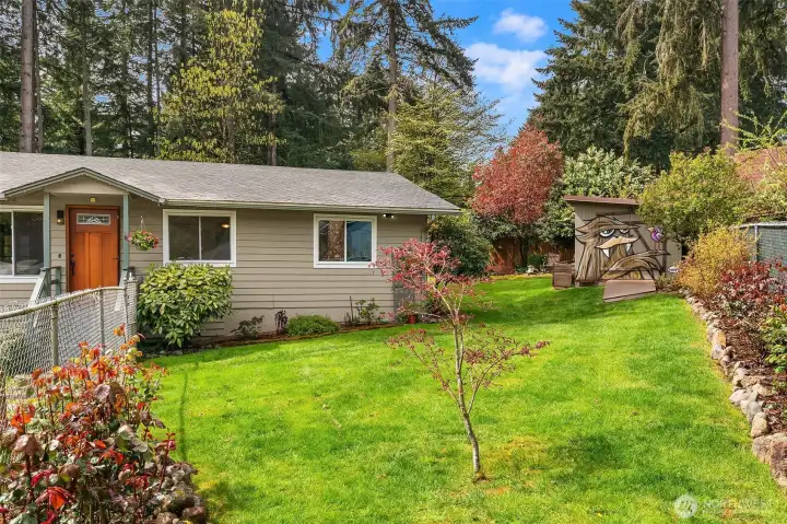 A fully fenced yard keep the deer away from your beautifully appointed gardens full of raspberries and blueberries, perennials, shrubs, and a privacy hedge.