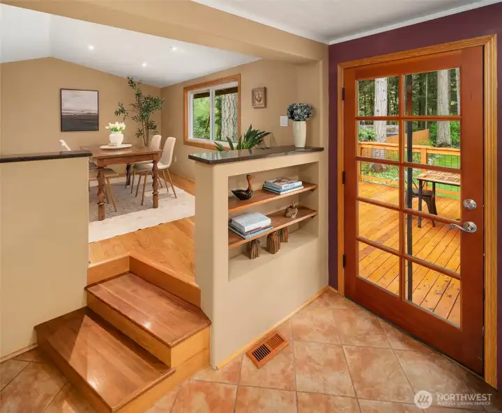 The raised dining room is a just off the kitchen. Check out the sweet built-in bookshelf for your cookbooks!