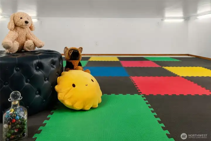 This playroom, or storage space, is accessed through a door in the dining room.