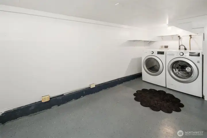 The spacious laundry space is accessed through the garage.