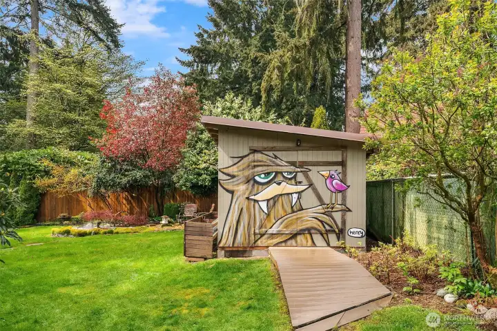 A large shed is ready for your yard tools, bikes, gardening supplies and anything else you need to keep safe from the weather. The Henry sasquatch is always happy to see you.