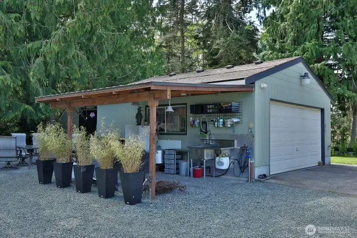 detached garage and covered area for bbq and fish cleaning sink