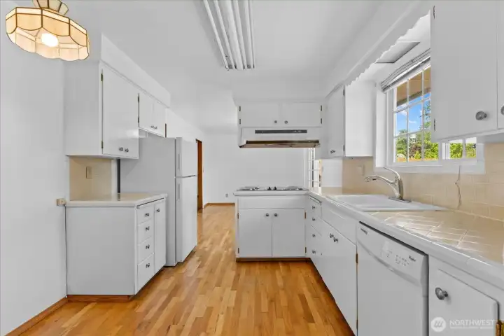 W working triangle Kitchen with dishwasher and plenty of space for nook or small table within the space