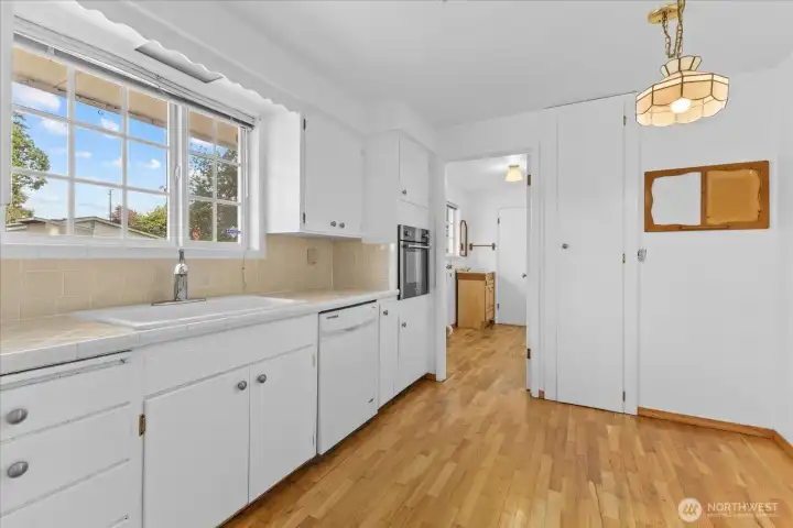 Another kitchen photo showing the entrance to the laundry/mudroom area