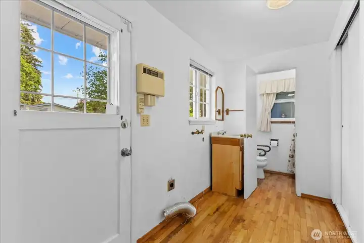 Laundry with sink and another bathroom
