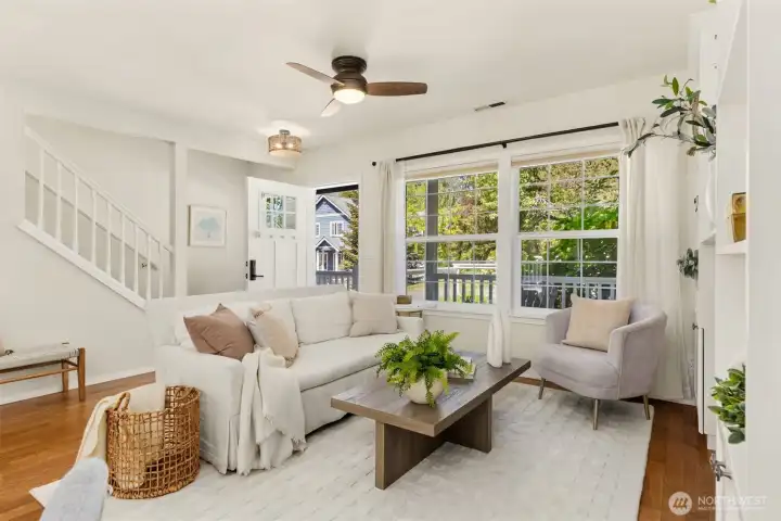 The living room is inviting with views out to the front yard and the open space across the street. The living room is inviting with views out to the front yard and the open space across the street.