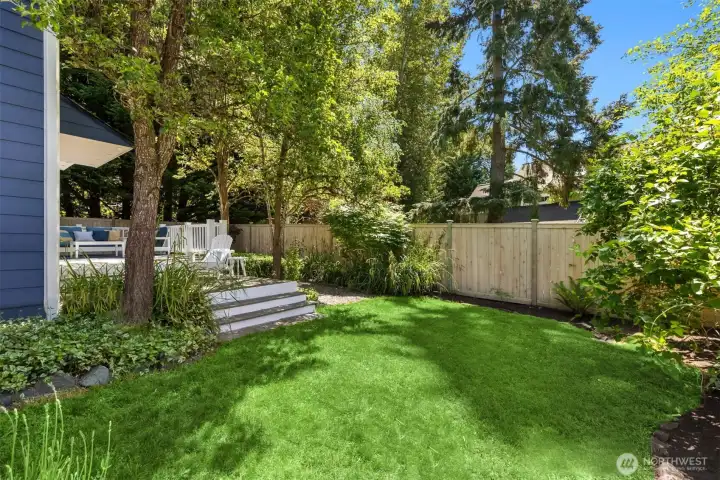The sweet grassy area in the back yard which is fully fenced with a stunning new fence. The sweet grassy area in the back yard which is fully fenced with a stunning new fence.