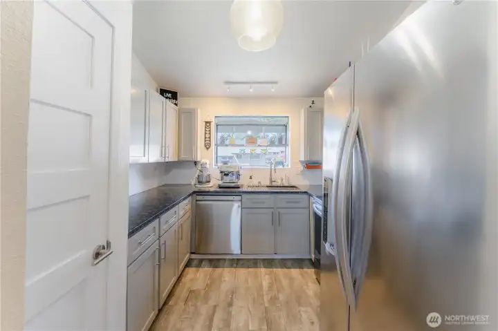 Beautifully updated Kitchen with stainless steel appliances and granite countertops