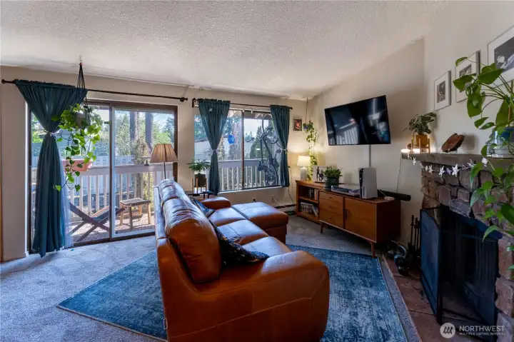 Open living space with wood burning fireplace