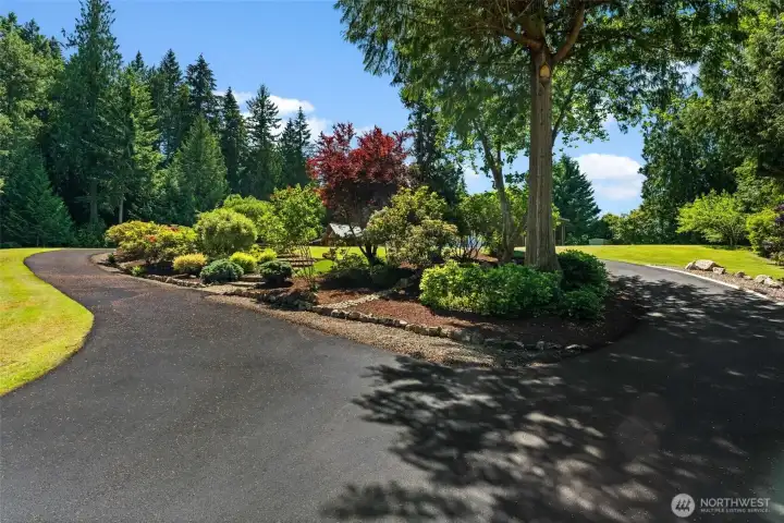 Almost 5 acres of meticulously land landscaped property