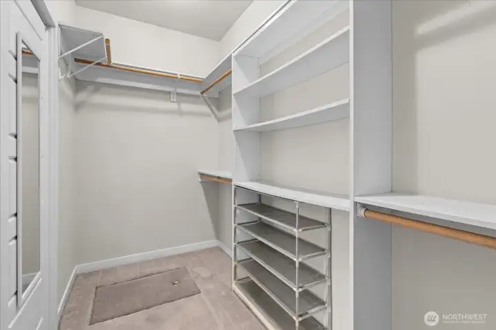 A generous walk-in closet with custom organization keeps everything neatly in its place, making busy mornings feel effortless. A generous walk-in closet with custom organization keeps everything neatly in its place, making busy mornings feel effortless.