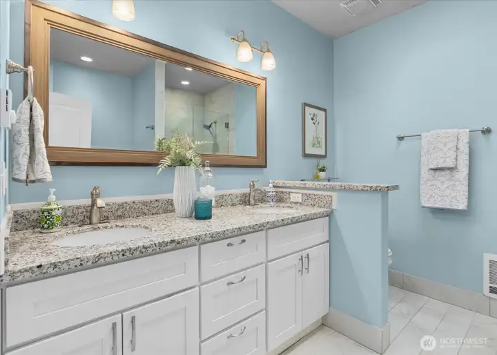Dual sinks, expansive counter space, and abundant storage create a functional and stylish space to begin and end each day. Dual sinks, expansive counter space, and abundant storage create a functional and stylish space to begin and end each day.