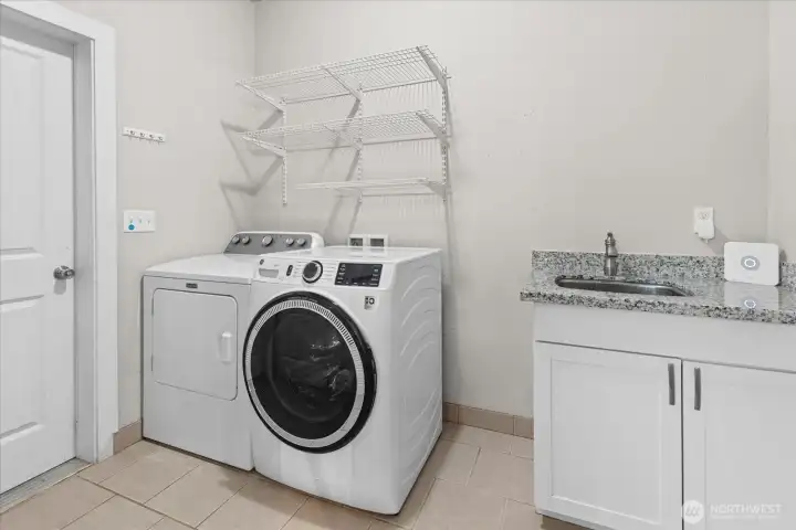 A spacious laundry room with extra storage and utility space helps keep everyday routines organized and efficient. A spacious laundry room with extra storage and utility space helps keep everyday routines organized and efficient.
