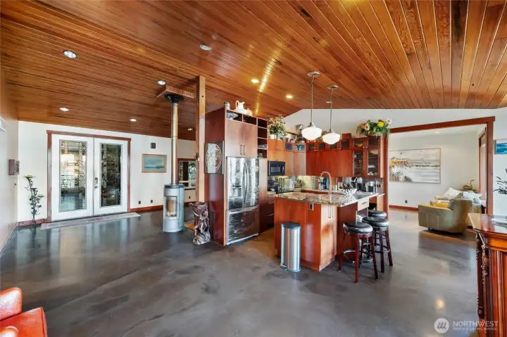 Welcome inside! The floor plan has an open concept with wood lined ceilings (the wood is reclaimed from Georgia Pacific) and the concrete floors are incredible - as well as everything in between! Welcome inside! The floor plan has an open concept with wood lined ceilings (the wood is reclaimed from Georgia Pacific) and the concrete floors are incredible - as well as everything in between!